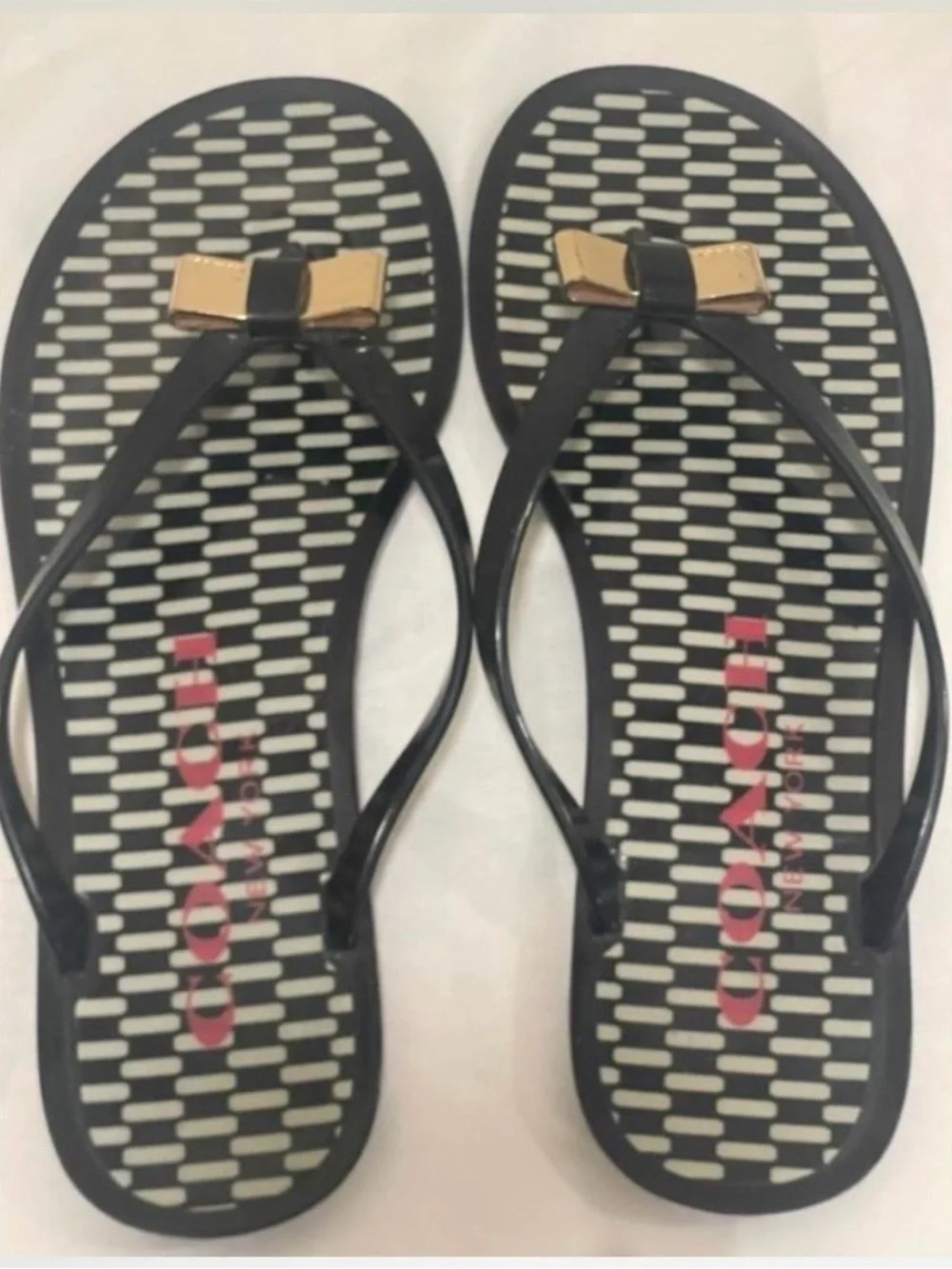 Coach Black and Gold Bow Jelly Flip Sandals